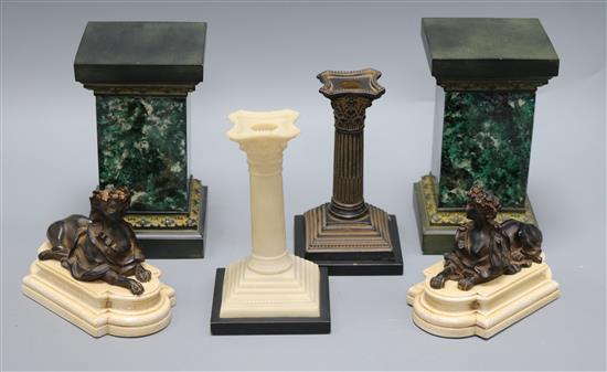 A pair of plinths, pair of bookends, pair of candlesticks